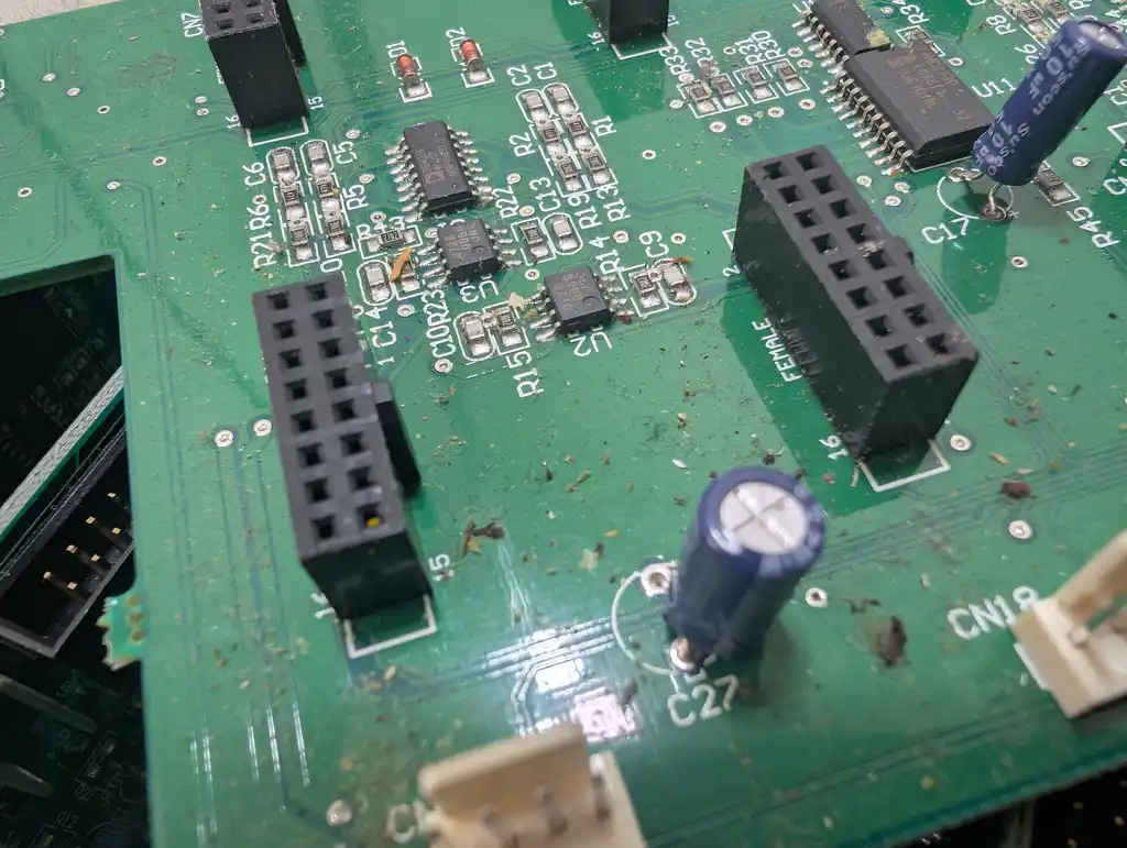 Close-up inside the Allen & Heath Xone:92 mixer around connector CN18, showing the box headers, the surface-mount ICs and the dirt that had built up across the board.
