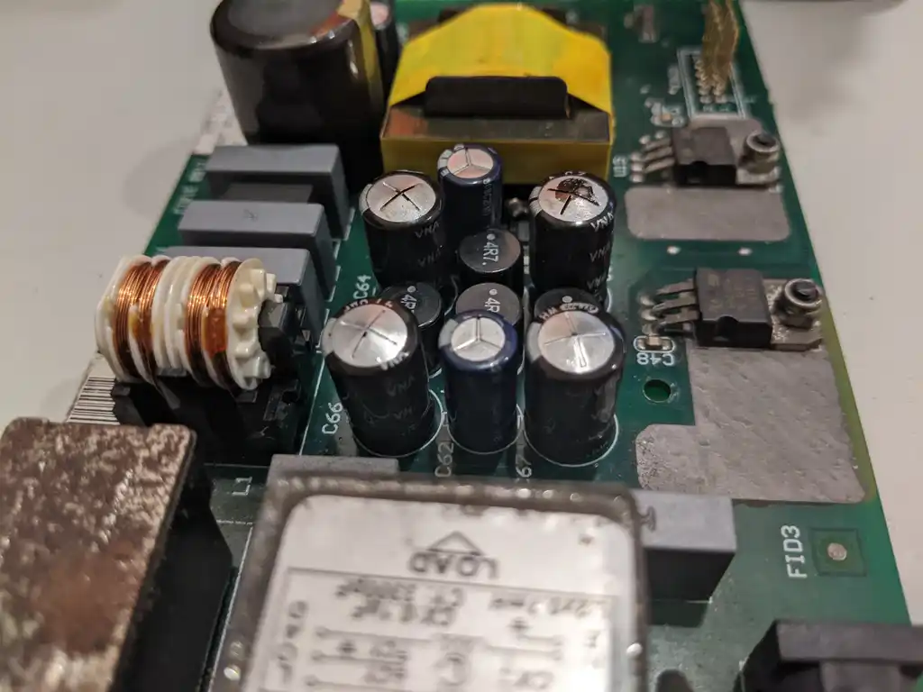The Allen & Heath Xone:92 mixer's supply board from its opposite corner, showing the toroidal choke, the main capacitor group and the boxed mains input filter.
