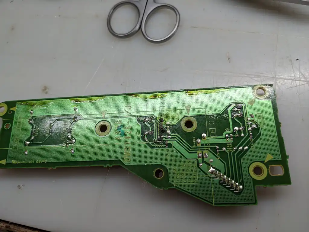 The solder side of the same Pioneer CDJ control board, with freshly reworked joints standing out bright against the original ones.