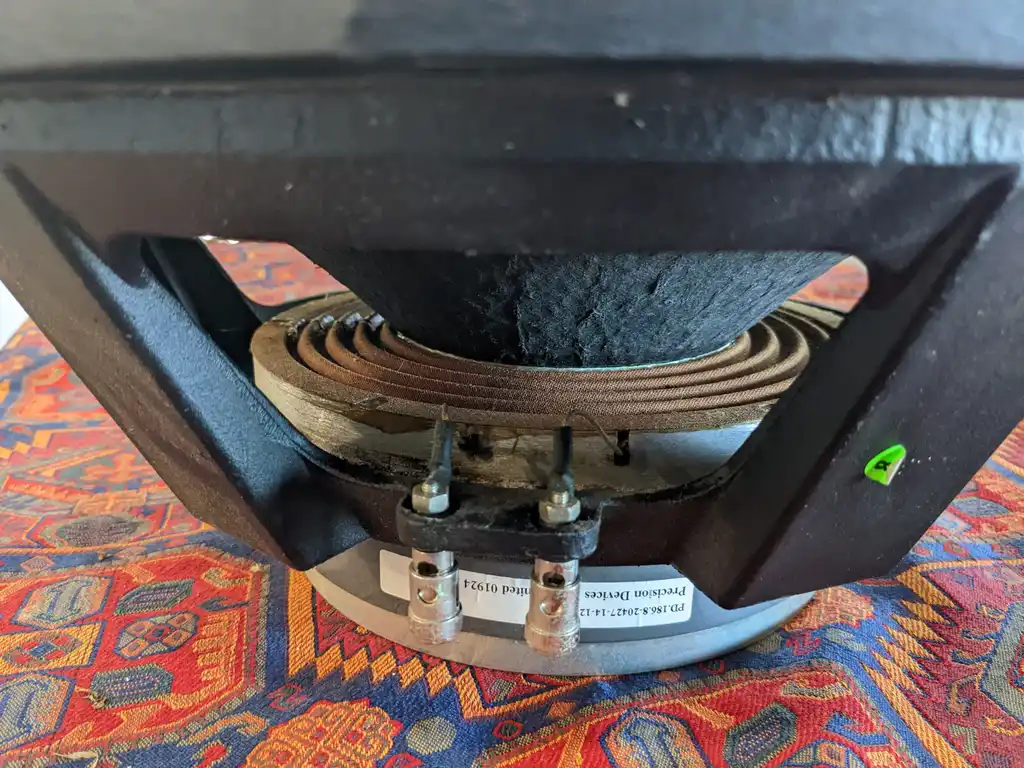 The underside of one Precision Devices PD186 driver, its spider and former charred black around the terminal plate.